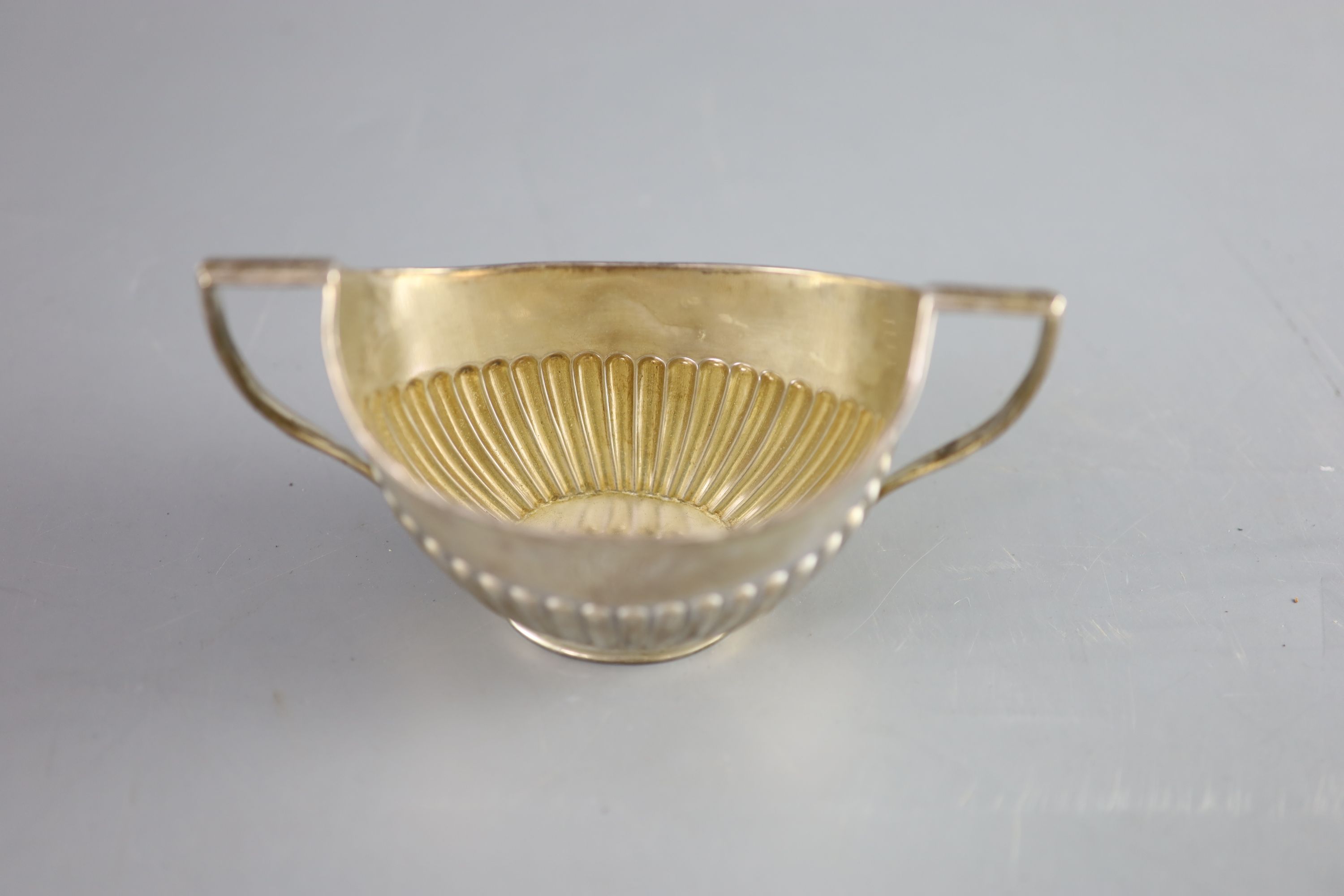 A Victorian demi fluted silver two handled oval sugar bowl, width 15.2cm, 107 grams.